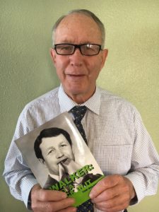 Photo of Dorrance author Tom Walker holding his book, "Walker: Put a Sock in it."