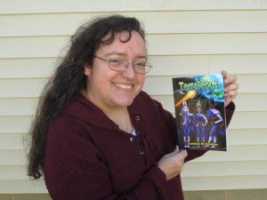 Dorrance author Kathleen Hamilton holding her book "Terralepus."