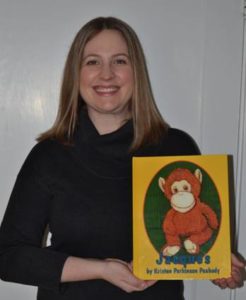 Dorrance Publishing author Kristen Peabody holding her book, "Jacques."