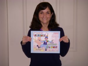 Picture of Dorrance author Rosey Terranova holding her book, "Alfonse the Littlest Clown."