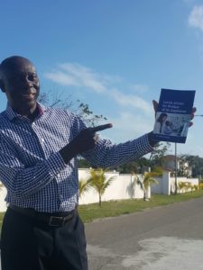 Dorrance author Hilton Bullard holding a copy of his published book.