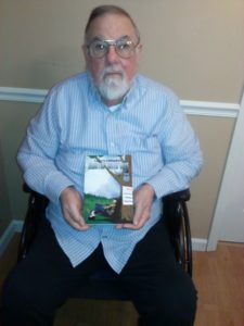 Dorrance author Larry Clifford with his book, "Huntin' with Gus."