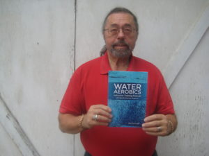 Dorrance author Robert Thomason holding his book.