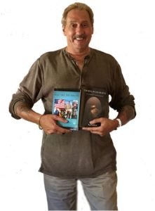 Dorrance author, Caeser Rondina holding his book, "The Soul in our Hearts."