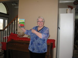 Dorrance author Judy May holding her book, "Life in the Laugh Lane."