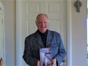 Picture of Dorrance author TJ Druhot holding his book, "All the Cardinal's Men and A Few Good Nuns - A Hospital Story."