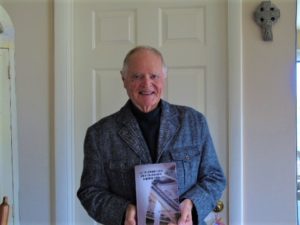 Picture of Dorrance author TJ Druhot holding his book, "All the Cardinal's Men and A Few Good Nuns - A Hospital Story."