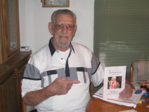 Picture of Dorrance author Chuck Morris holding his book, "You...and the Beautiful Moments (A Journal of Love, Prose, and Poetry."