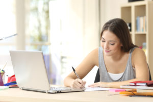 woman writing and typing