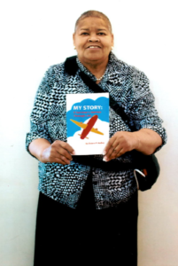 Picture of Dorrance Publishing author Debra Holley holding her book, "My Story: A Survivor's Story Through Life"