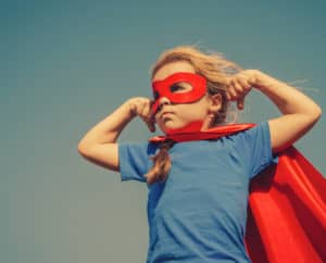 superhero girl in red cape